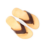 Pair of Flip Flops in Chestnut leather with V-shaped thong straps and natural footbeds, top-down view