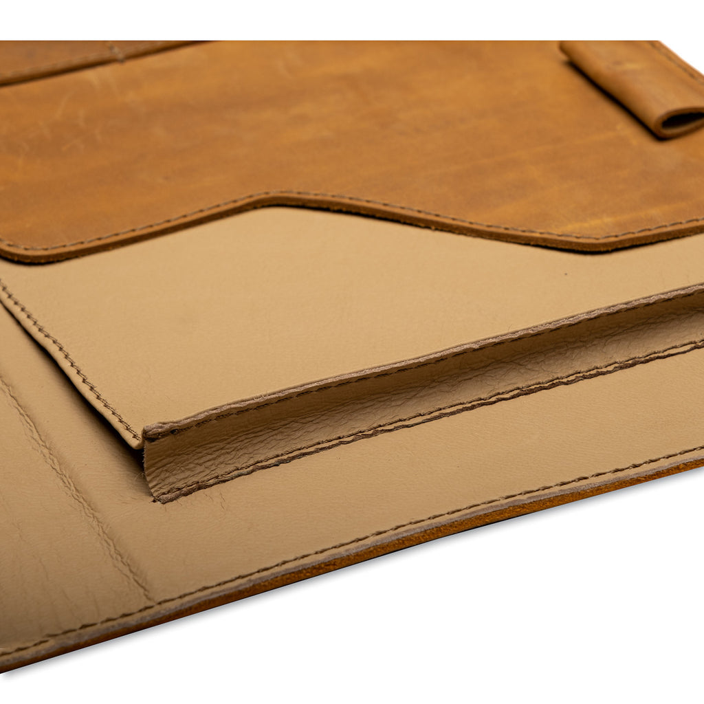 Large Leather Portfolio in Tobacco, close-up of the tan leather interior pocket and stitched edges