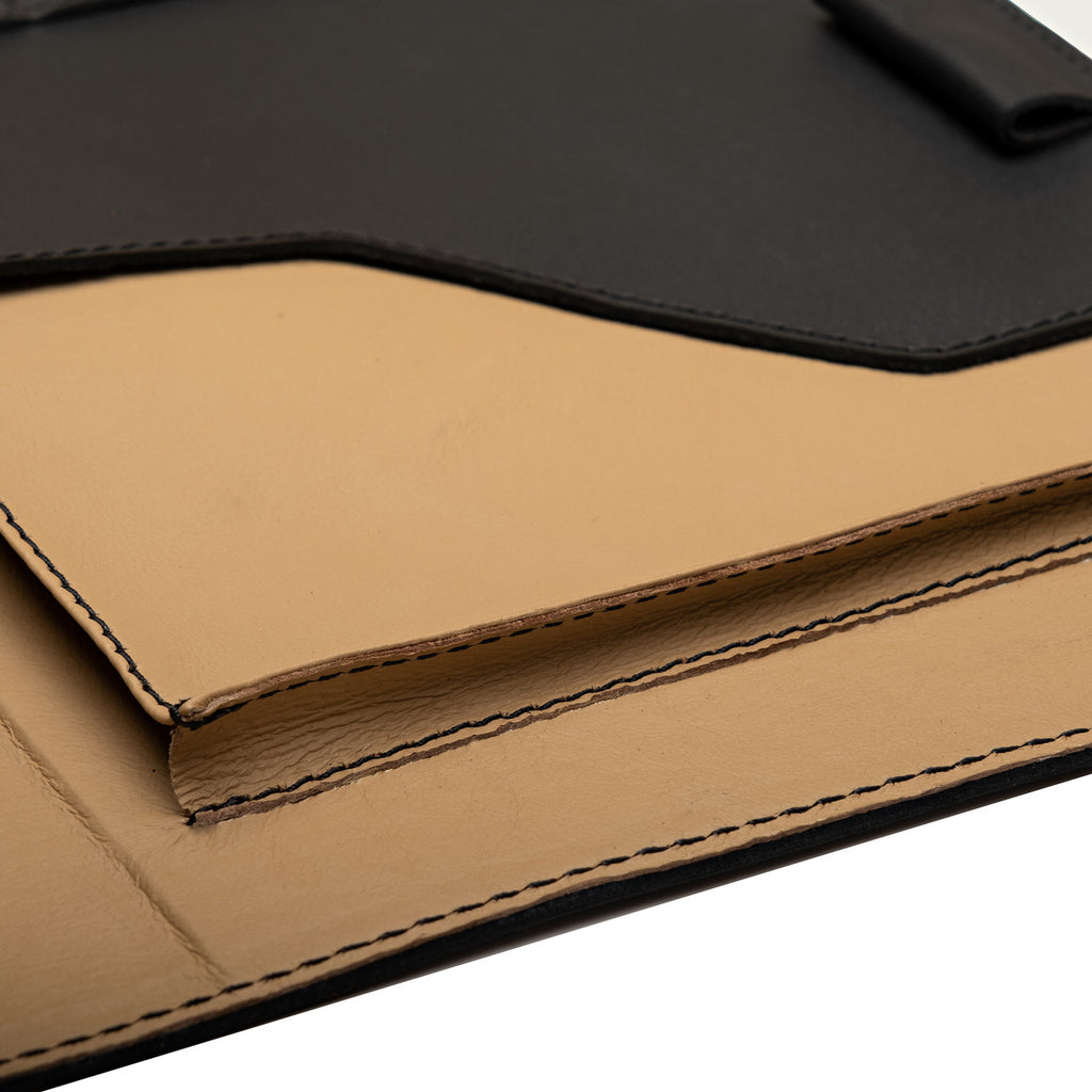 Large Leather Portfolio in Black, close-up of the tan leather interior pocket and stitched edges