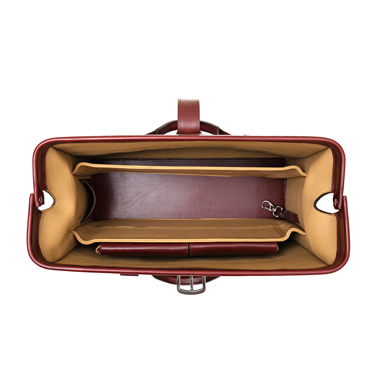 Spurgeon Briefcase in Oxblood, top-down view of the open frame mouth showing tan-lined compartments