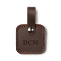 Leather Bag Tag in Chestnut with snap strap, personalized with an engraved DCM monogram