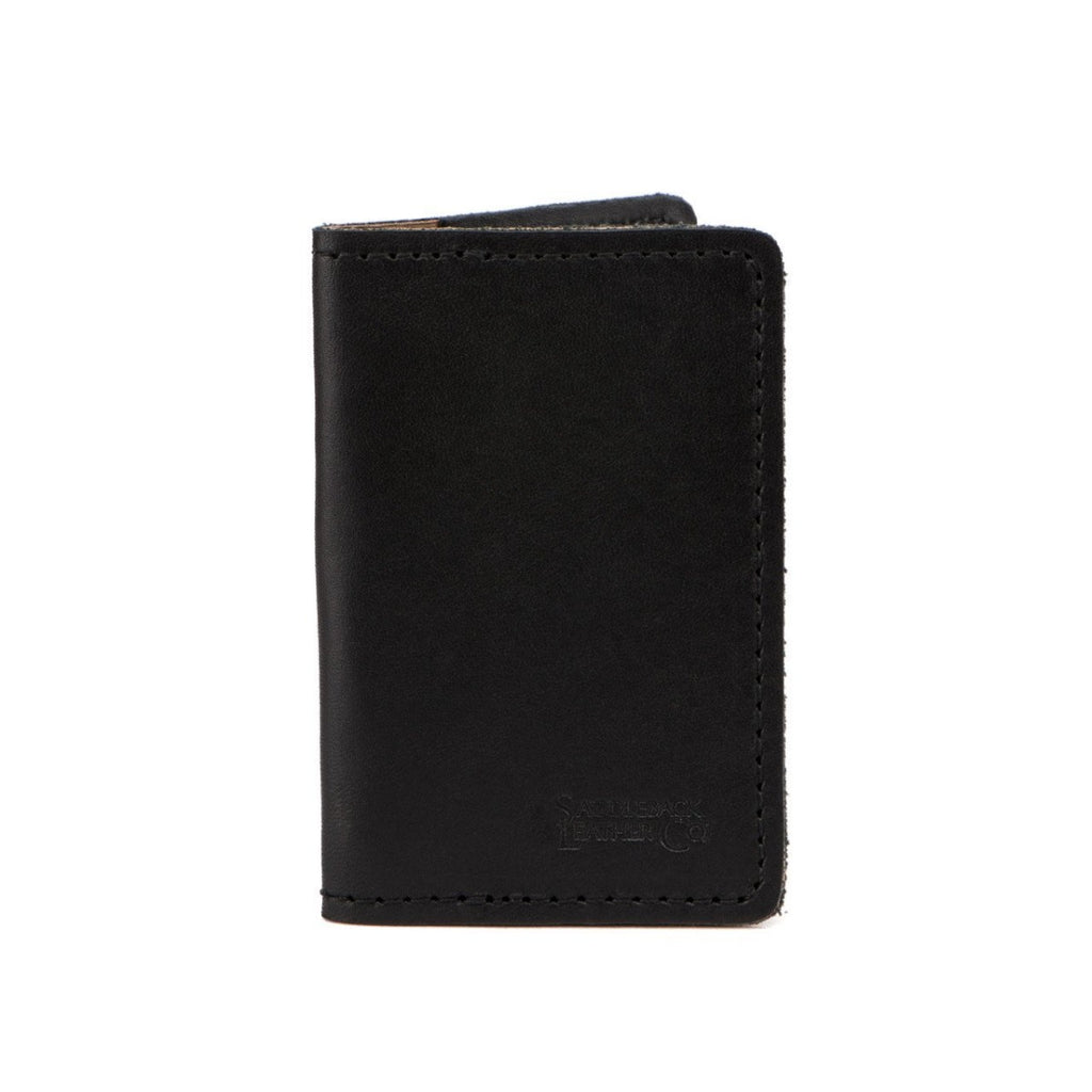 Slim Business Card Holder in Black leather, closed front view with embossed logo