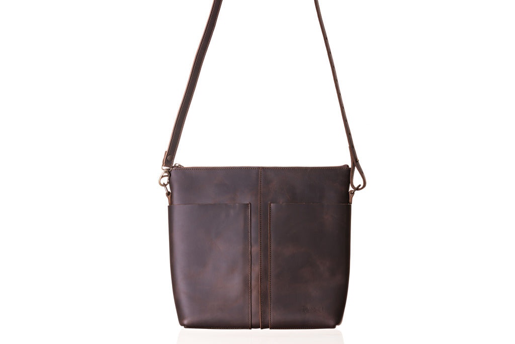 Minimal Leather Bag in dark brown, front view with two slip pockets and adjustable shoulder strap