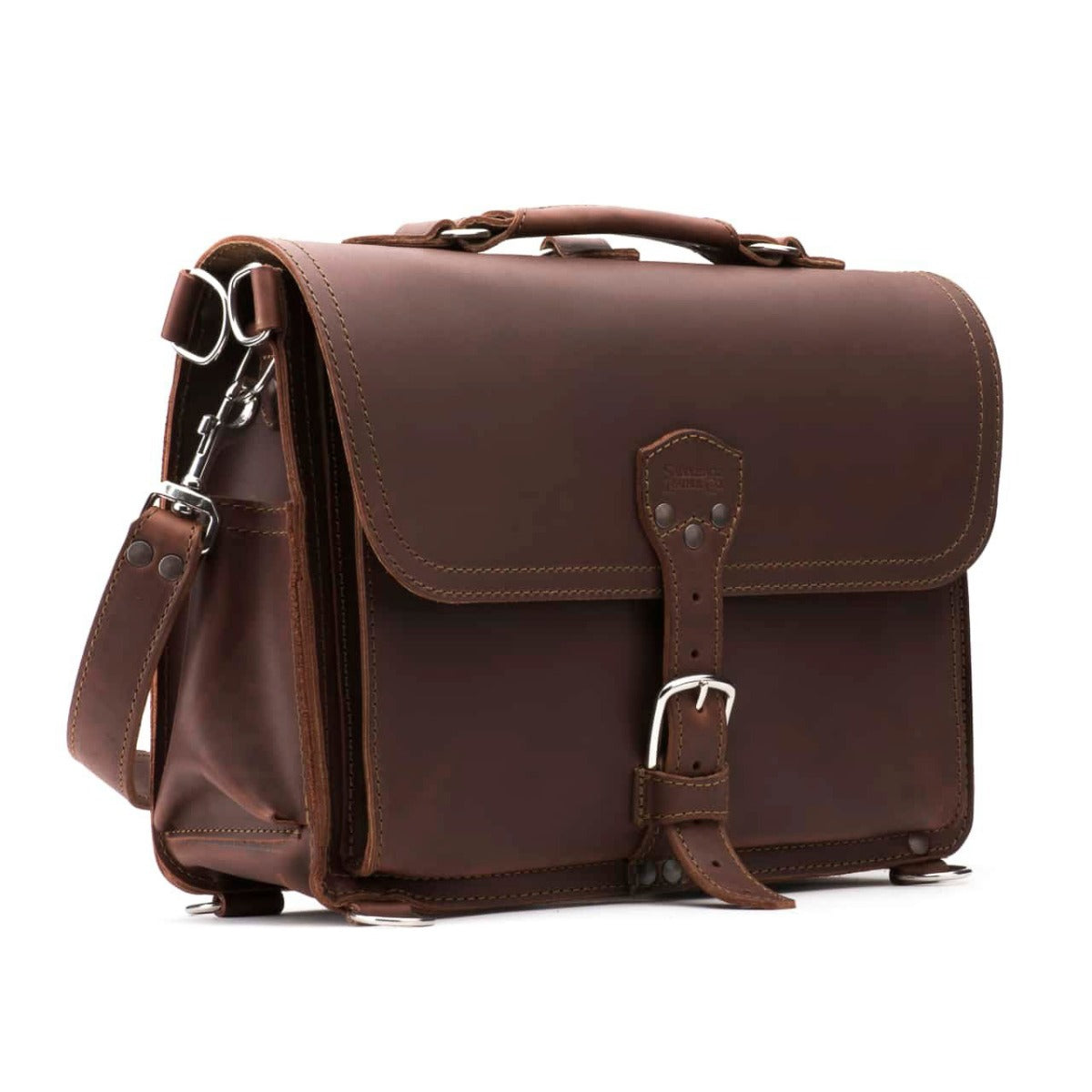 Slim Leather Briefcase in Chestnut, angled front view with buckled flap, top handle and shoulder strap