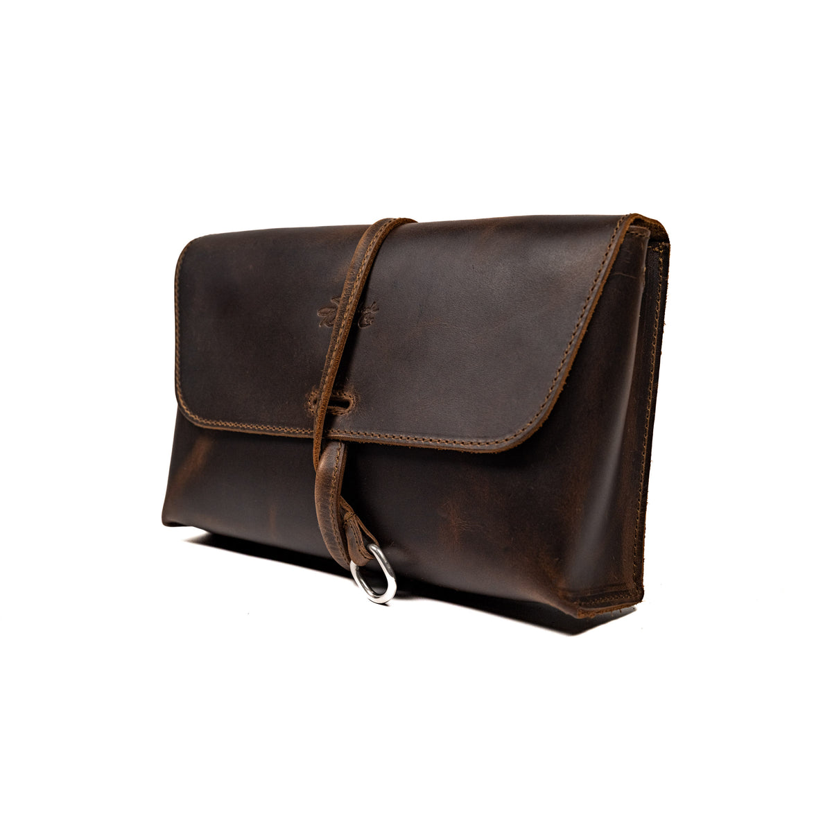 Large Leather Organizer Bag in Dark Coffee Brown, closed flap with wrapped leather tie and ring, angled view