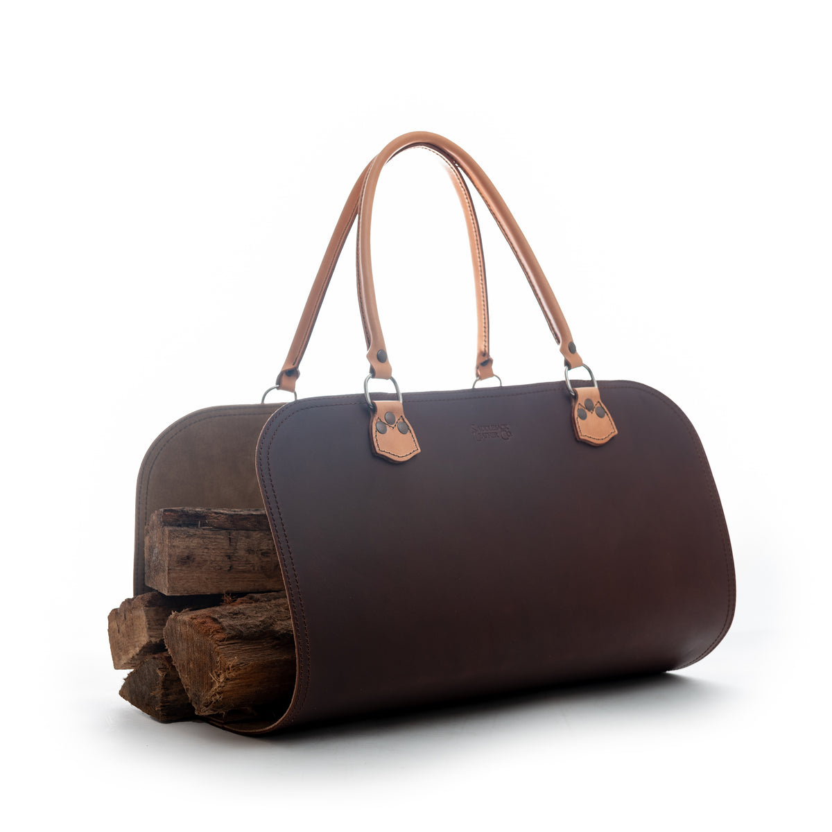 Leather Log Carrier in Chestnut with tan carry handles, holding firewood, side view