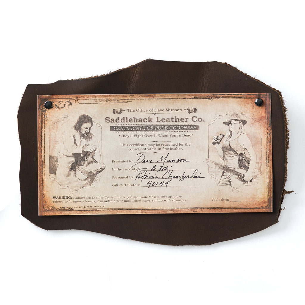 Printed SBL Gift Certificate with vintage illustrated design riveted onto a dark brown leather hide