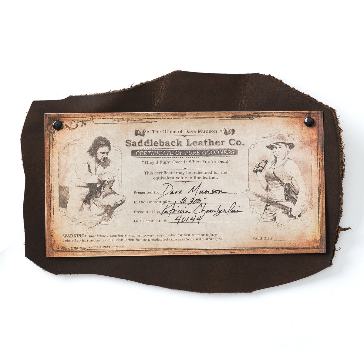 Printed SBL Gift Certificate with vintage illustrated design riveted onto a dark brown leather hide