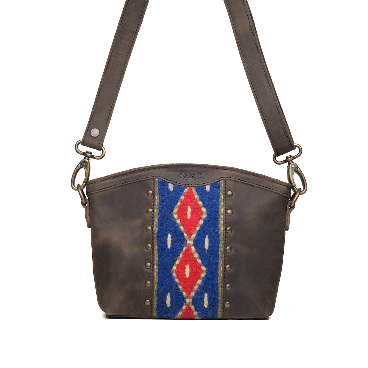 Lanita Small Crossbody in charcoal gray, front view with blue and red woven panel, studs and shoulder strap