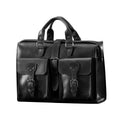 Flight Bag Leather Briefcase in black, angled front view with two buckled pockets and top handles