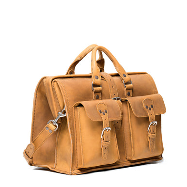 Barrister's Briefcase in Tobacco, angled front view with top handles, two buckled front pockets and shoulder strap
