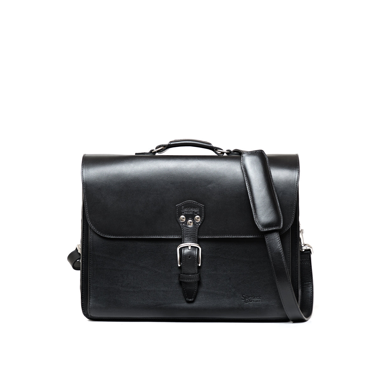 Livingstone Briefcase in Raven Black, front view with buckled flap, top handle and shoulder strap