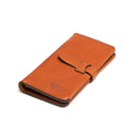 Big Wallet in English Tan, closed angled view with strap closure and debossed logo