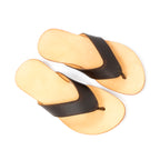 Pair of Flip Flops in Dark Coffee Brown leather with V-shaped thong straps and natural footbeds, angled view