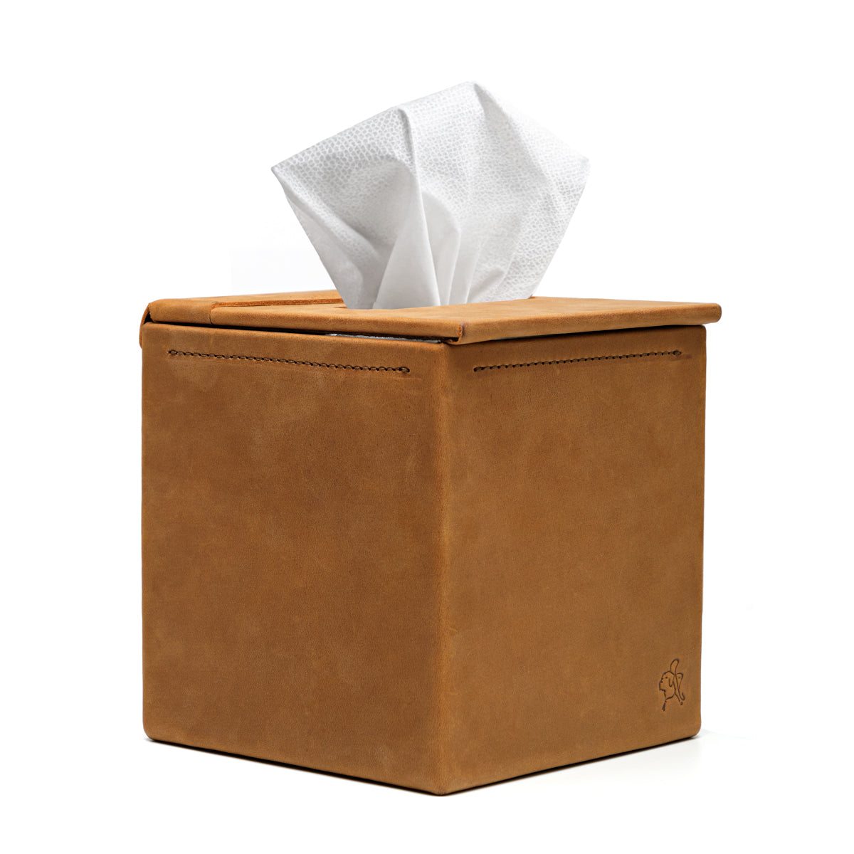 Tissue Box in Tobacco leather, angled front view with stitched edges and a tissue pulled from the top slot