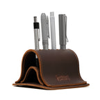 Pen Holder Bell Curve in Dark Coffee Brown leather, front view holding four pens with embossed Saddleback Leather Co. logo