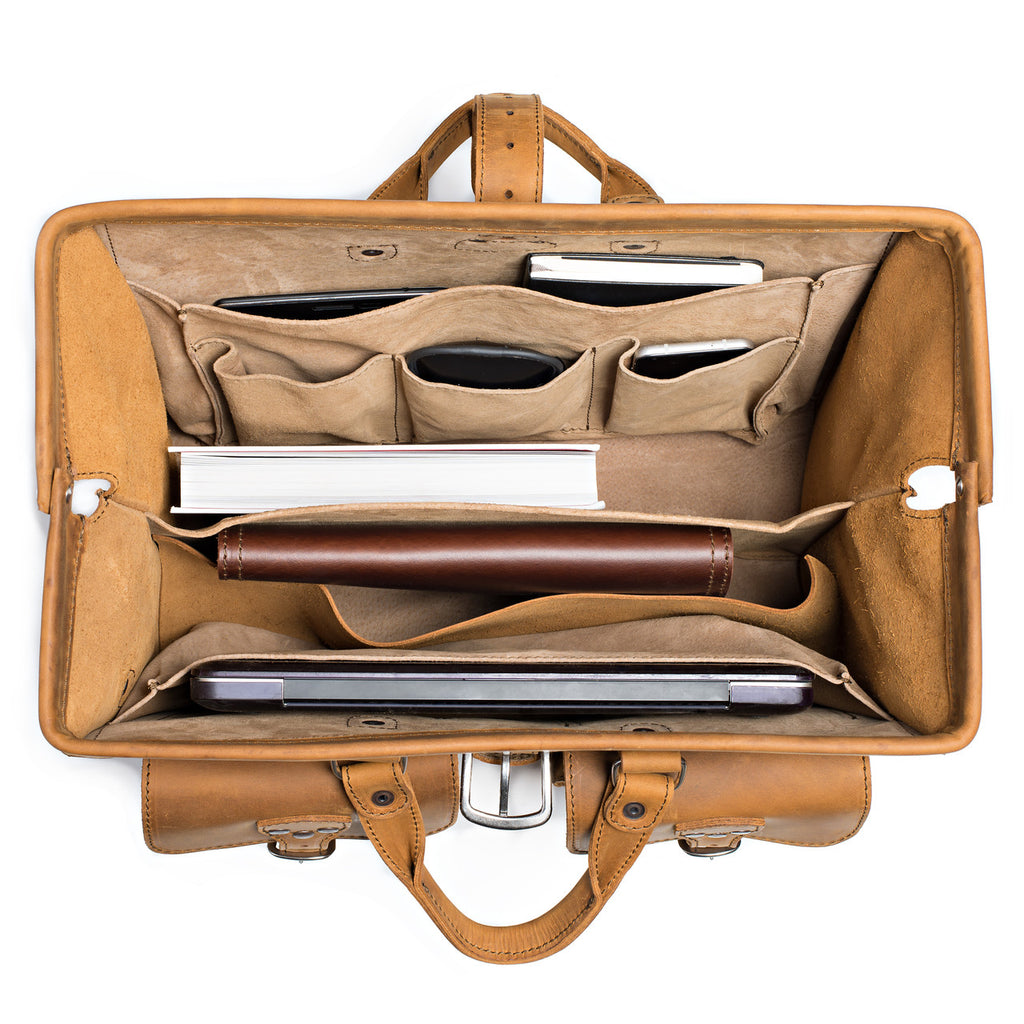 Barrister's Briefcase in Tobacco, top view open and packed with a laptop, notebook, phone and leather case
