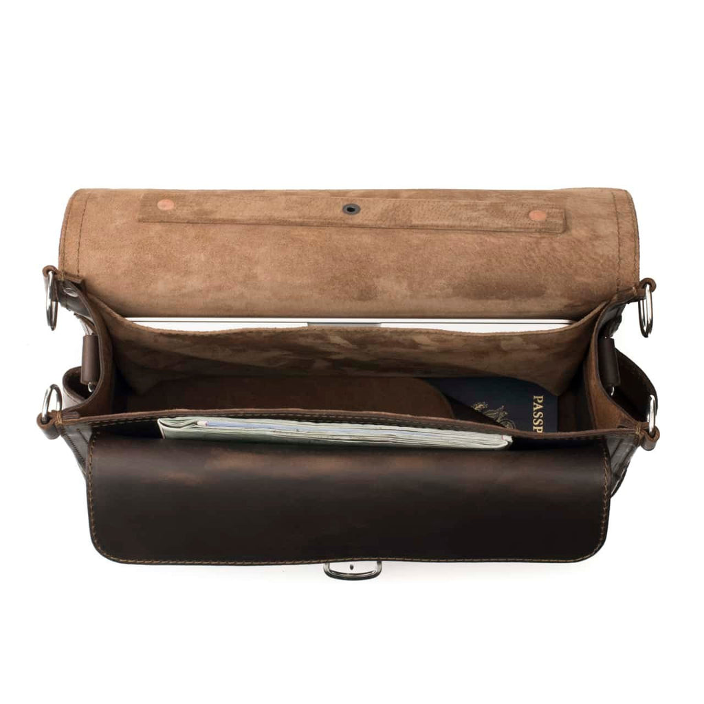Slim Leather Briefcase in Dark Coffee Brown, top view open showing a laptop, passport and papers inside