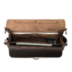 Slim Leather Briefcase in Dark Coffee Brown, top view open showing a laptop, passport and papers inside