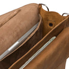 Slim Leather Briefcase in Tobacco, close-up inside view of the pigskin-lined compartments holding a laptop and papers