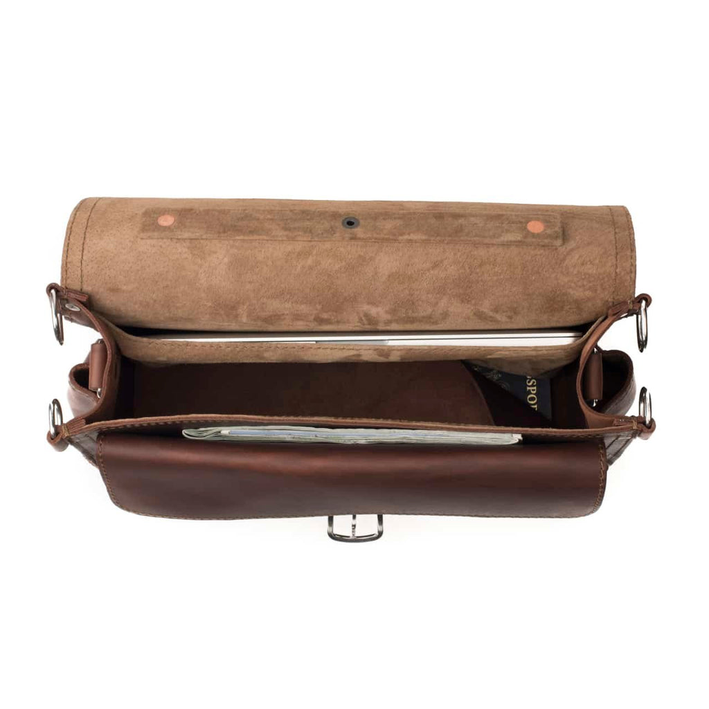 Slim Leather Briefcase in Chestnut, top view open showing a laptop, passport and papers inside