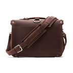 Slim Leather Briefcase in Chestnut, back view with padded shoulder strap and luggage handle pass-through