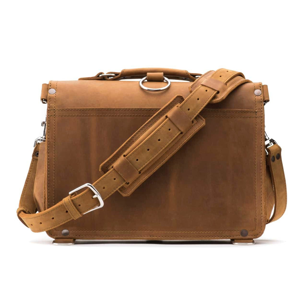 Slim Leather Briefcase in Tobacco, back view with padded shoulder strap and luggage handle pass-through