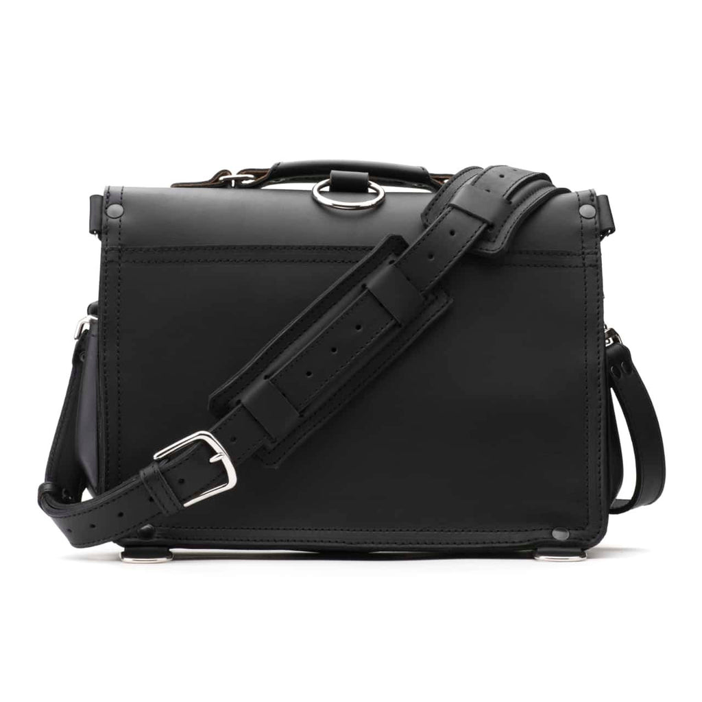 Slim Leather Briefcase in Black, back view with padded shoulder strap and luggage handle pass-through