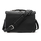 Slim Leather Briefcase in Black, back view with padded shoulder strap and luggage handle pass-through