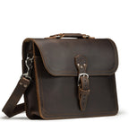 Fourteener Thin Leather Briefcase in Dark Coffee Brown, angled front view with top handle, buckled flap and shoulder strap