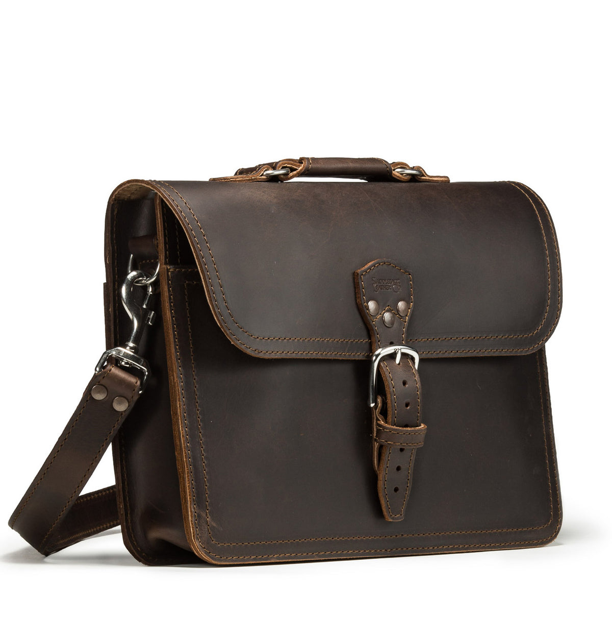 Fourteener Thin Leather Briefcase in Dark Coffee Brown, angled front view with top handle, buckled flap and shoulder strap