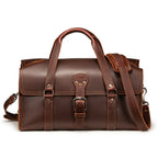 20" Baby Beast Duffle Bag in Chestnut, front view with center buckle strap and shoulder strap