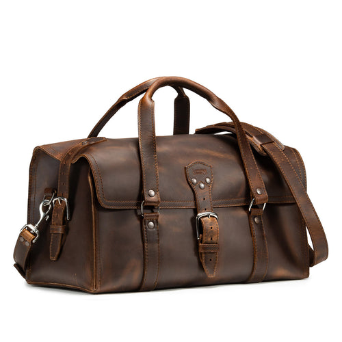 20" Baby Beast Duffle Bag in Dark Coffee Brown, angled front view with buckle straps and shoulder strap