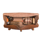 34" Beast Duffle Bag in Tobacco, top view packed with a wooden tennis racket, thermos, shoes and books