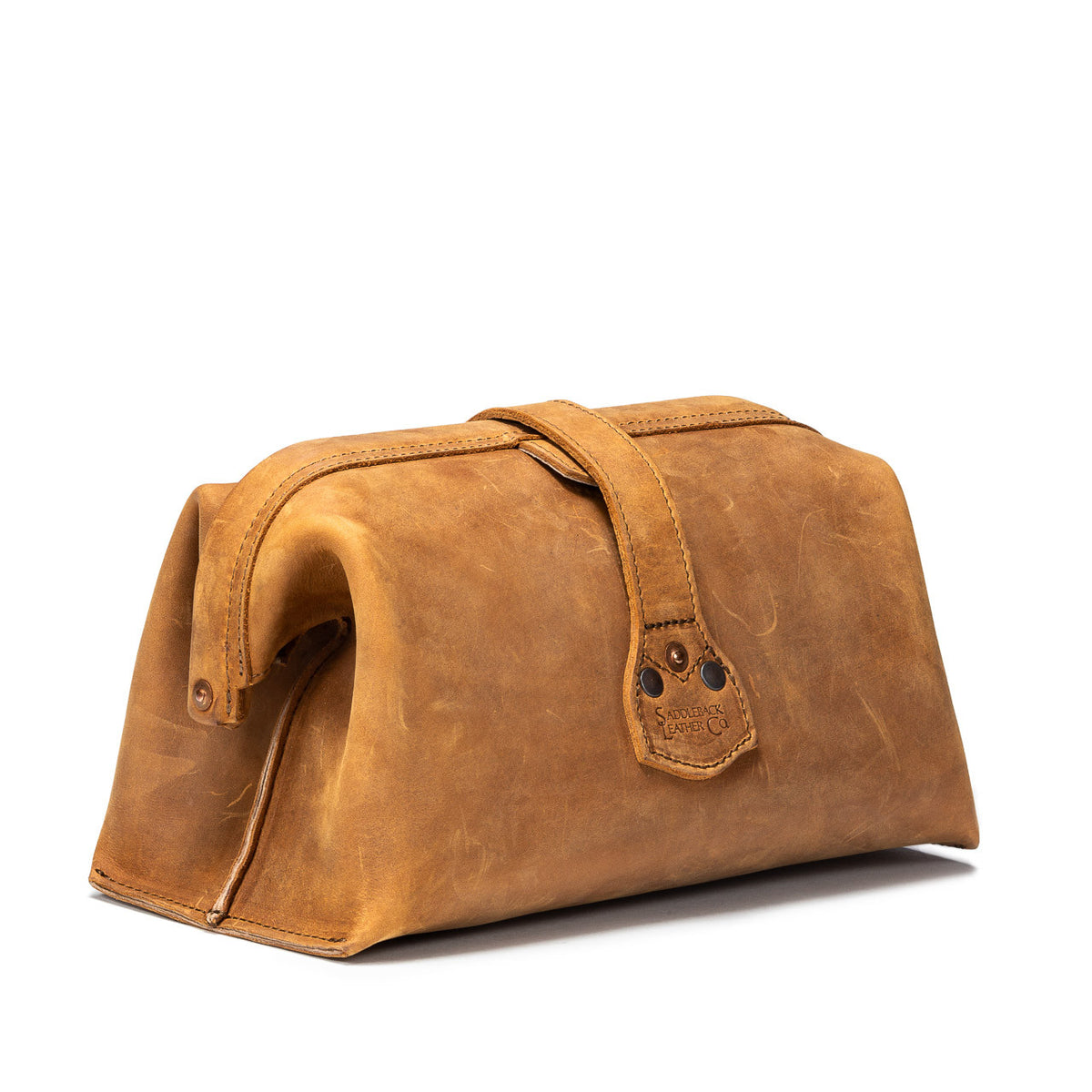 Big Mouth Leather Toiletry Bag in Tobacco, angled back view showing riveted strap end