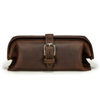 Little Big Mouth Toiletry Bag in Dark Coffee Brown, front view with wide frame top and buckled strap closure