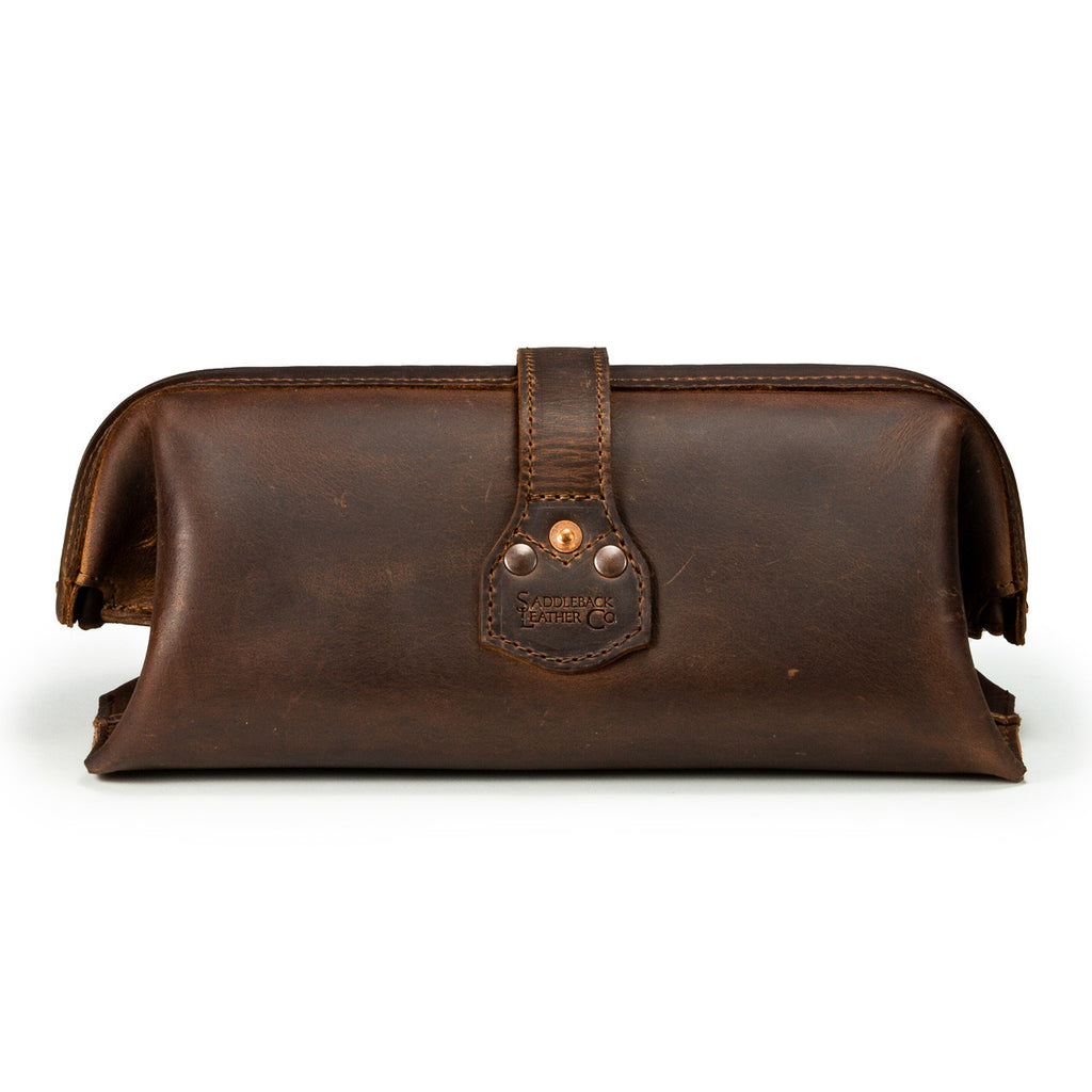 Little Big Mouth Toiletry Bag in Dark Coffee Brown, back view with riveted strap tab and embossed logo