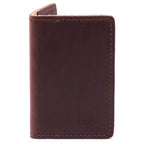 Slim Business Card Holder in Chestnut leather, closed close-up showing stitched edges and embossed logo