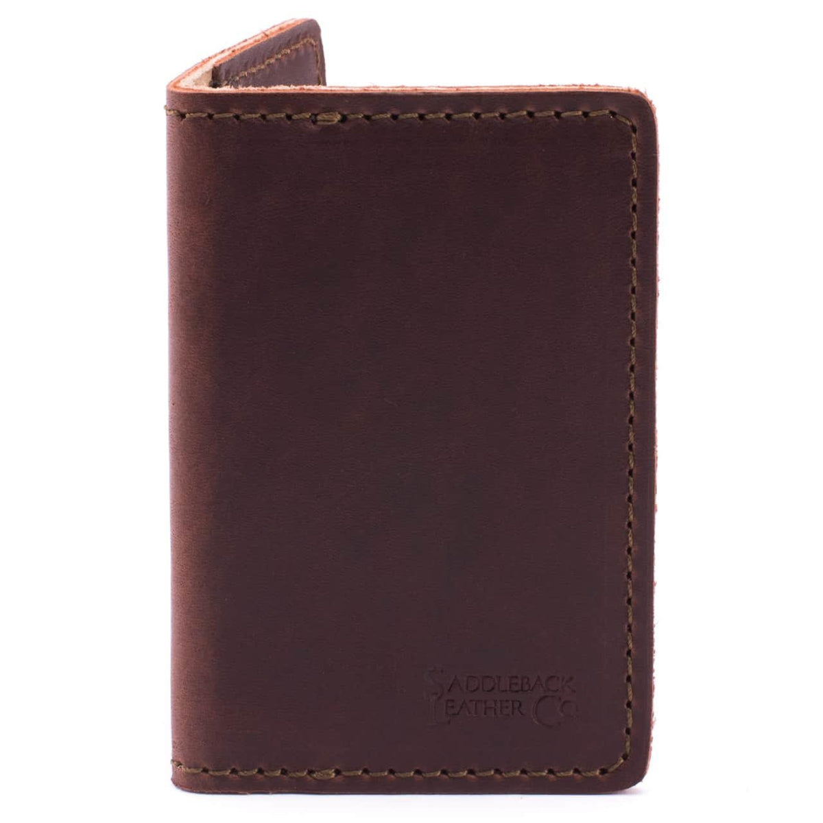 Slim Business Card Holder in Chestnut leather, closed close-up showing stitched edges and embossed logo