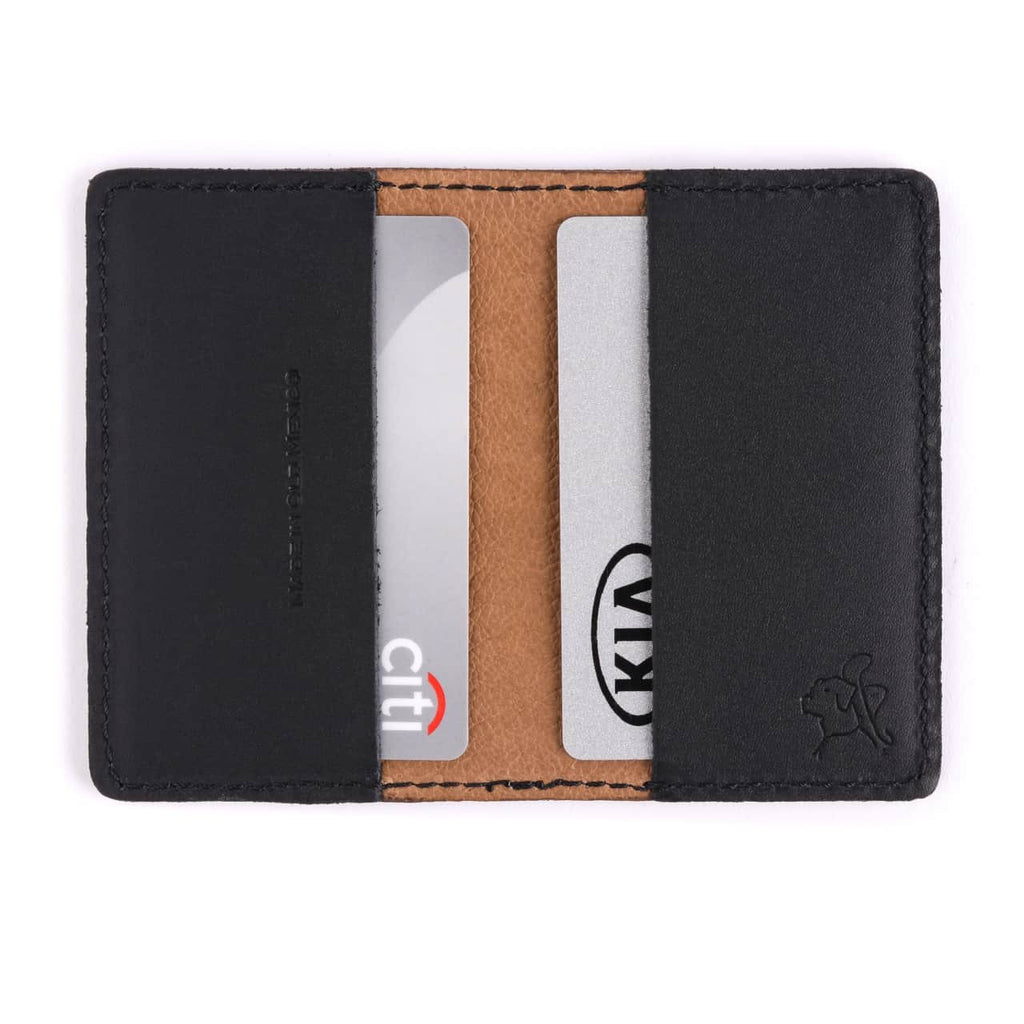 Slim Business Card Holder in Black opened flat with cards in both inner pockets