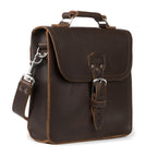 Indiana Leather Satchel in Dark Coffee Brown, angled front view with buckled flap, top handle and shoulder strap