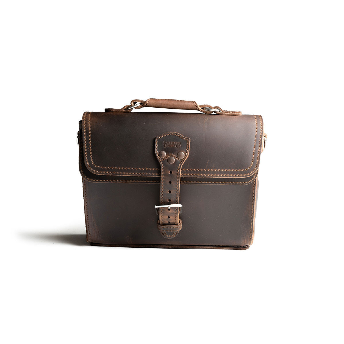 Front Pocket Leather Satchel in Dark Coffee Brown, straight-on front view with riveted buckle strap and top handle
