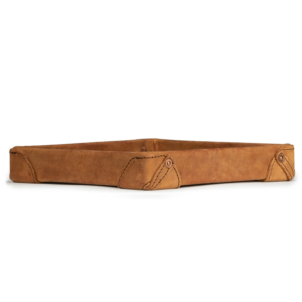 The Leather Grandfather Valet Tray in Tobacco, low side view showing stitched corner tabs with rivets