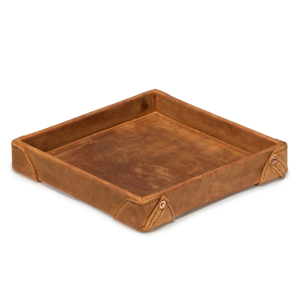 The Leather Grandfather Valet Tray in Tobacco, empty, angled view showing interior and riveted corner tabs