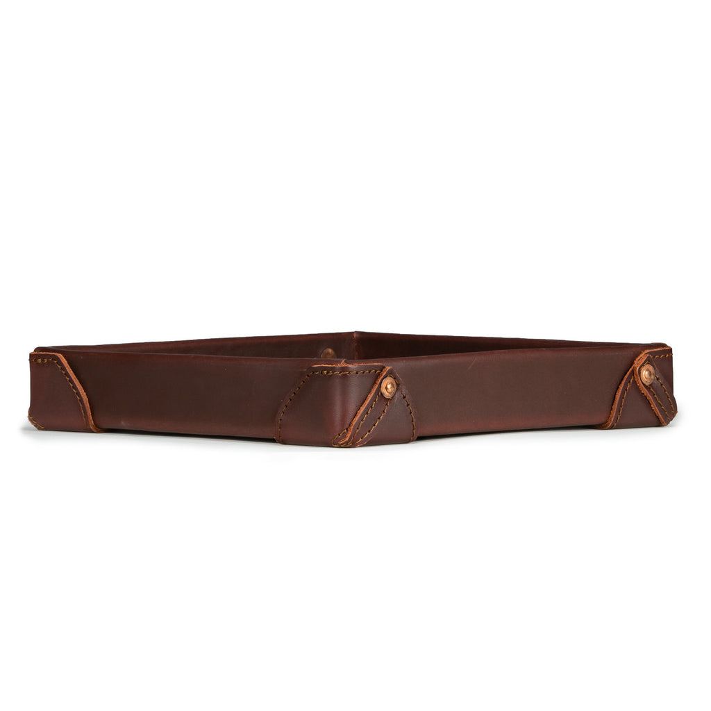 The Leather Grandfather Valet Tray in Chestnut, low side view showing stitched corner tabs with rivets