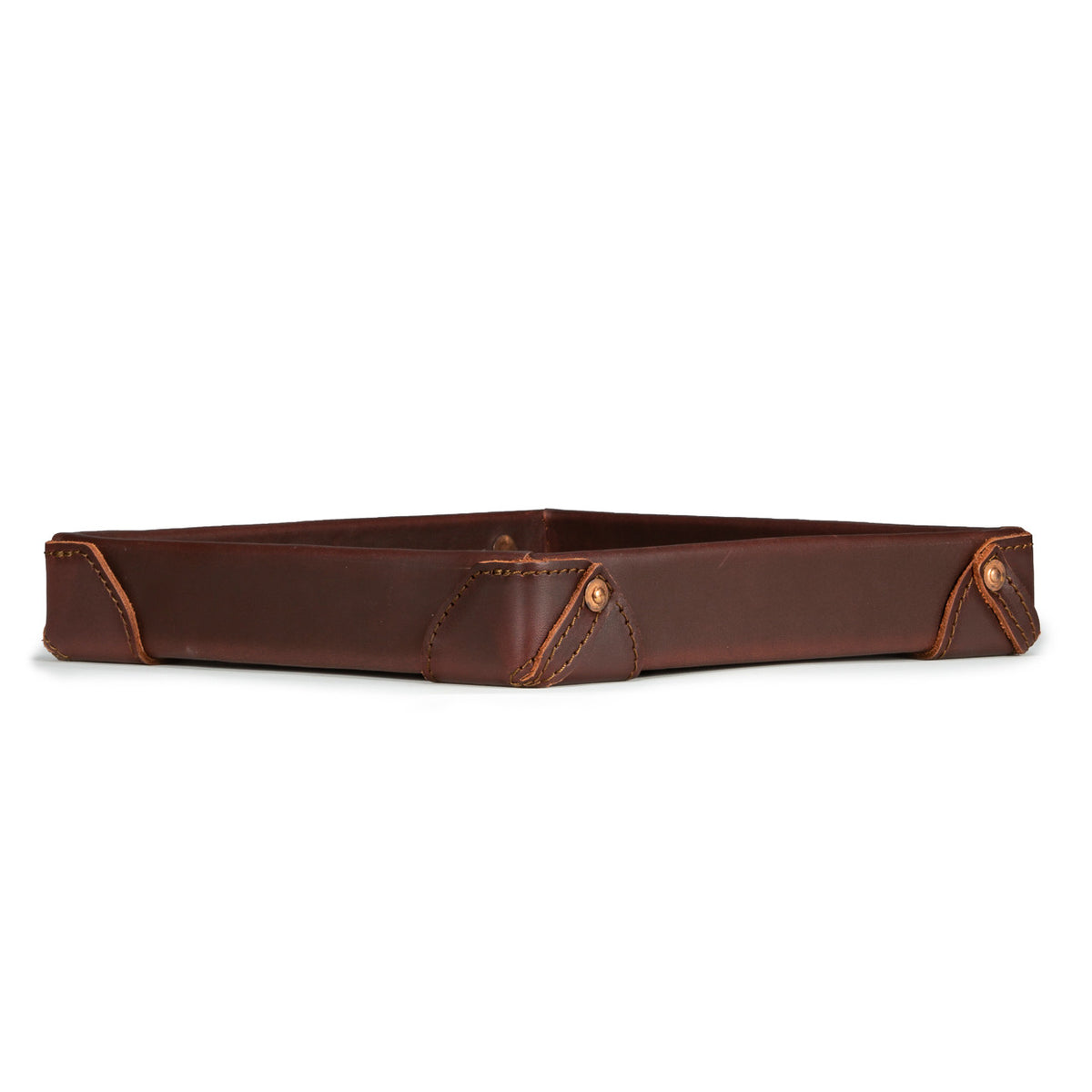 The Leather Grandfather Valet Tray in Chestnut, low side view showing stitched corner tabs with rivets