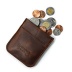 Bear Trap Leather Coin Purse in Dark Coffee Brown, angled view with coins spilling from the spring-clasp opening
