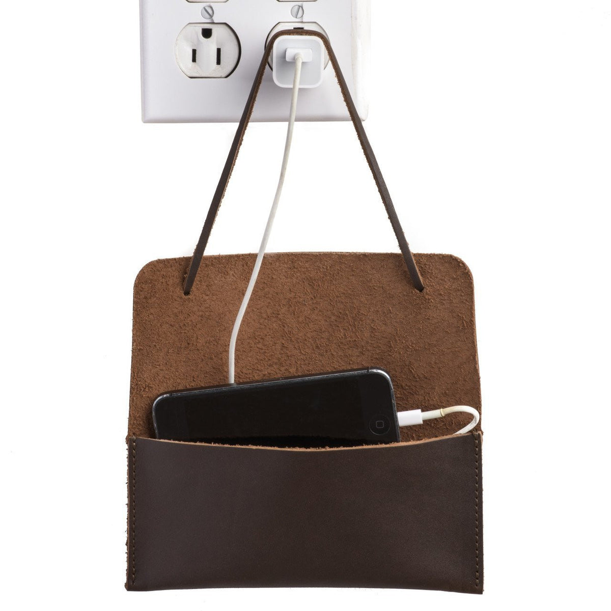 Cash & Receipt Bag in Dark Coffee Brown hung from a wall outlet by its tie, holding a charging phone