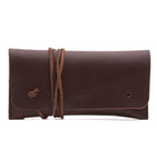 Cash & Receipt Bag in Chestnut, closed flap with wrapped leather tie and embossed logo, front view