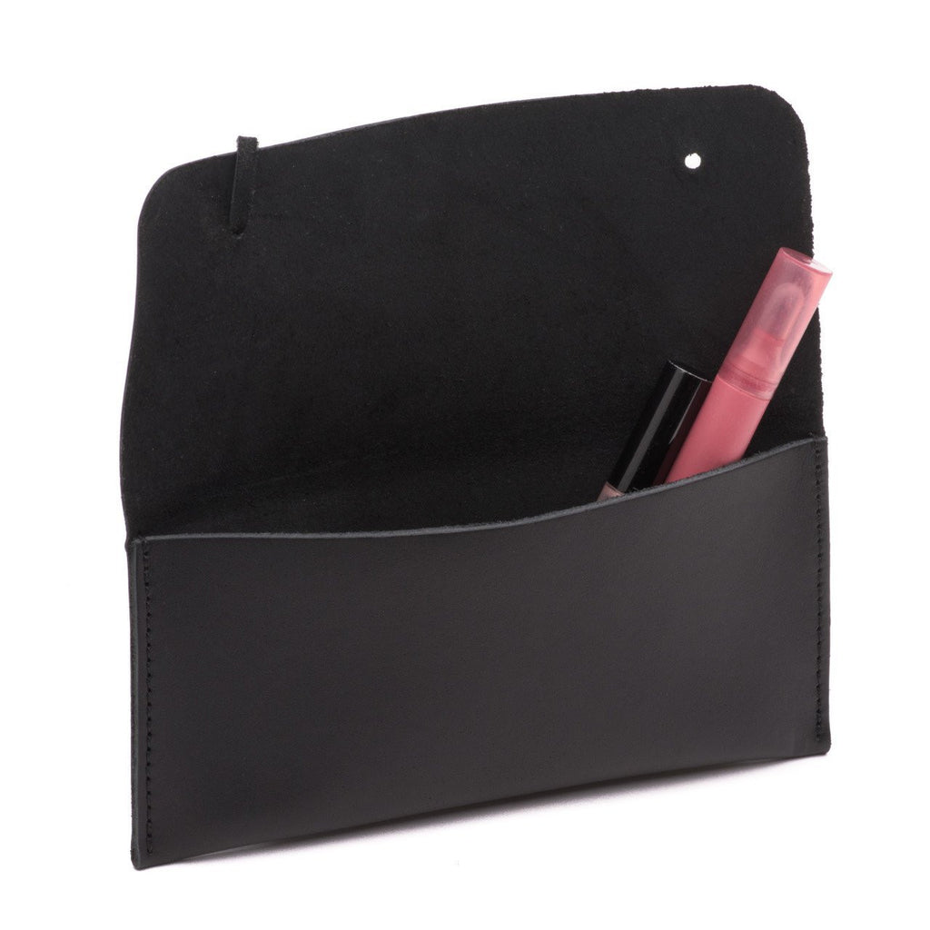 Cash & Receipt Bag in Black, flap open with a lip gloss and mascara tucked inside
